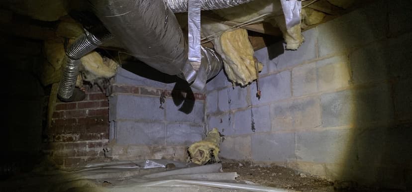 HydroHelp911 Crawl Space & Foundation Repair inspecting deteriorating insulation and moisture in a crawl space.