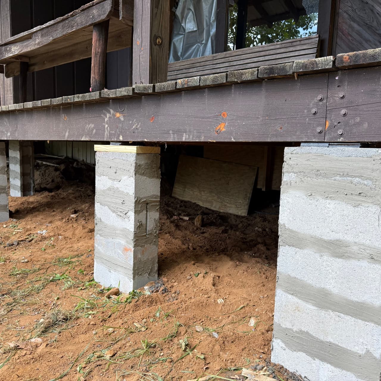 HydroHelp911 Crawl Space & Foundation Repair installing concrete block piers for pier and beam repair.