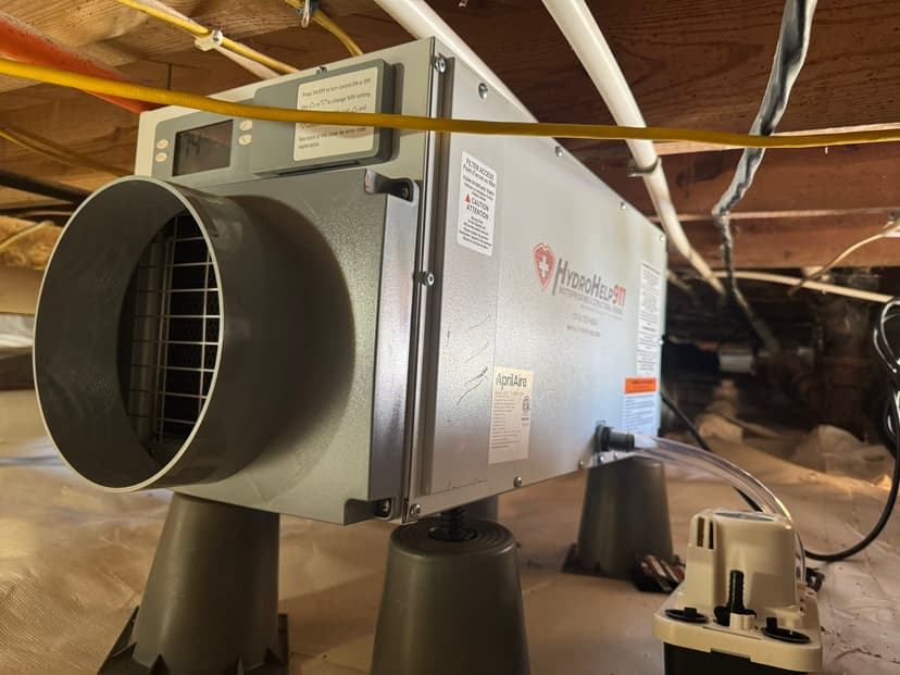 HydroHelp911 Crawl Space & Foundation Repair installing a new dehumidifier in an encapsulated crawl space.