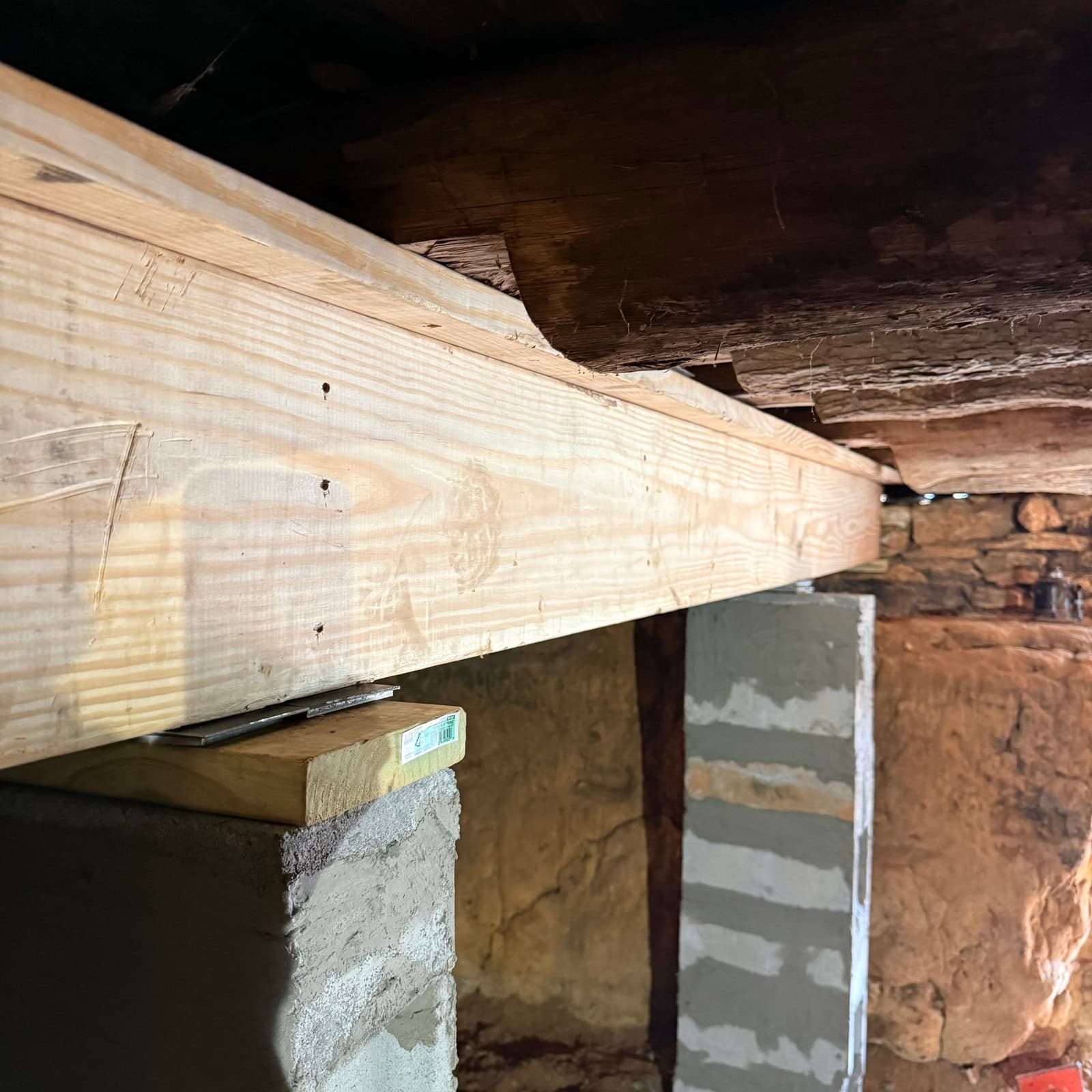 HydroHelp911 Crawl Space & Foundation Repair performing joist sistering and installing wood beam support in a crawl space
