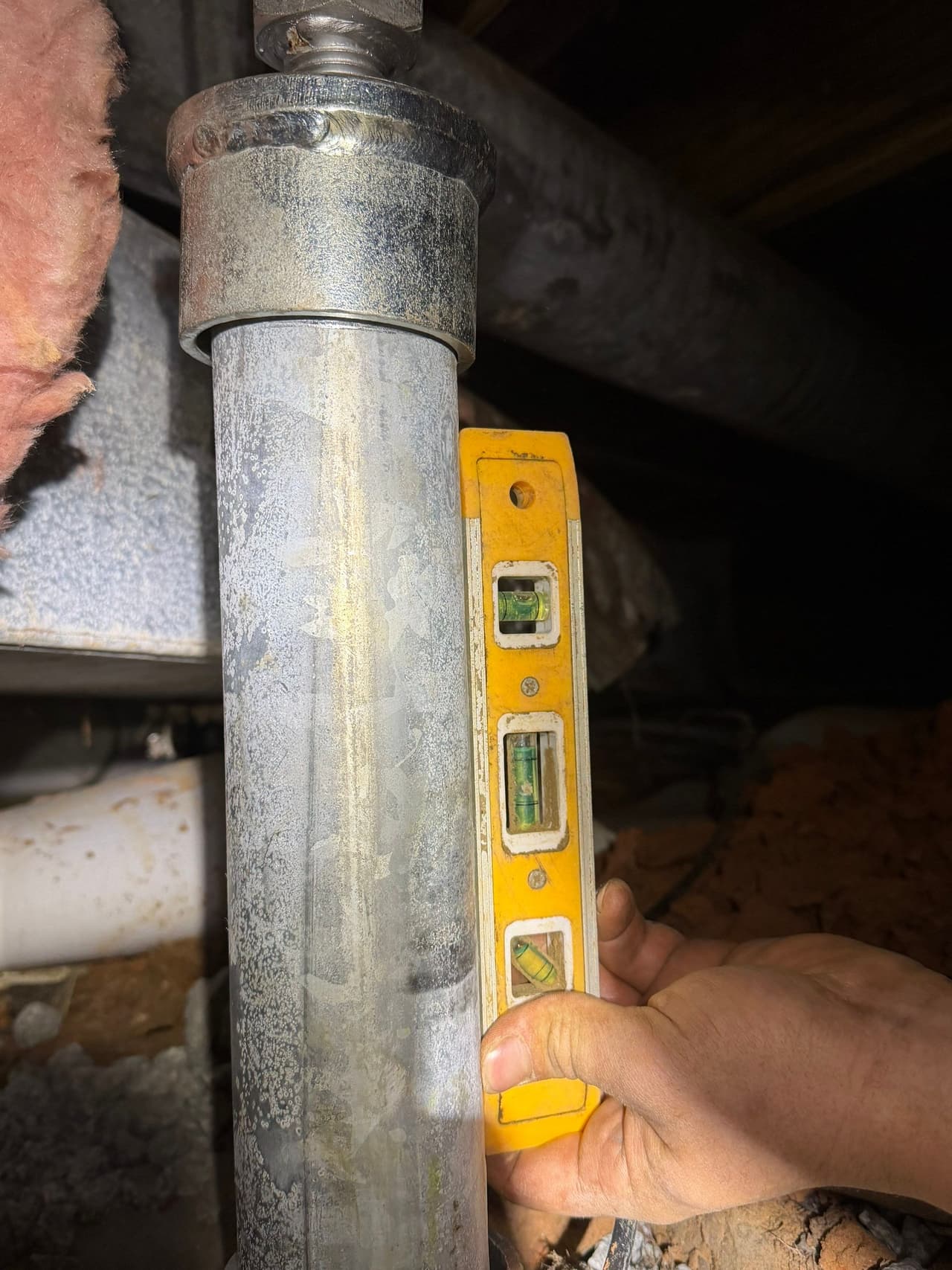 HydroHelp911 Crawl Space & Foundation Repair technician leveling a crawl space jack for structural repair.