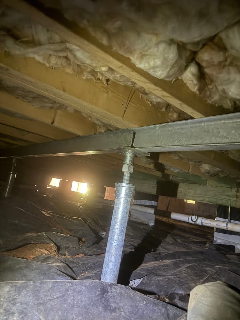 HydroHelp911 Crawl Space & Foundation Repair installing crawl space jacks and support beams.