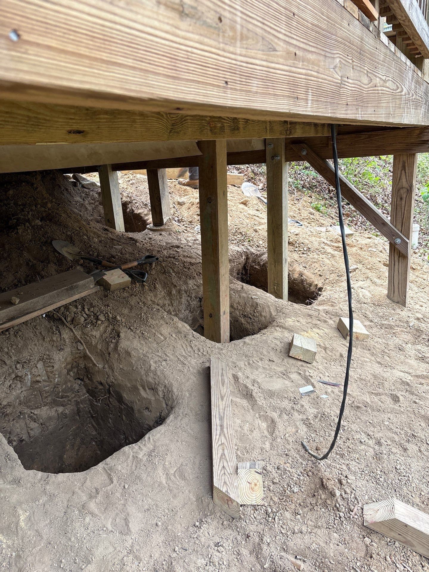 HydroHelp911 Crawl Space & Foundation Repair performing excavation for post and pier structural repair