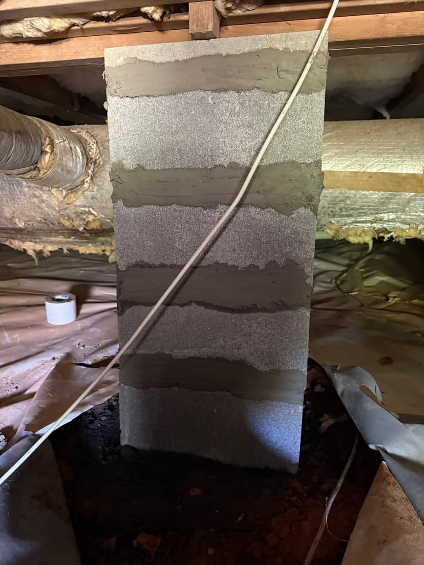 HydroHelp911 Crawl Space & Foundation Repair installing a new concrete block pier in a crawl space.