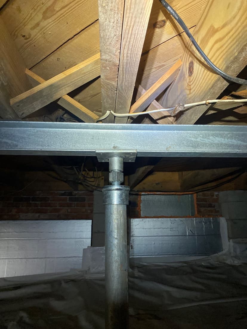 HydroHelp911 Crawl Space & Foundation Repair installing a crawl space jack and a steel I-beam.