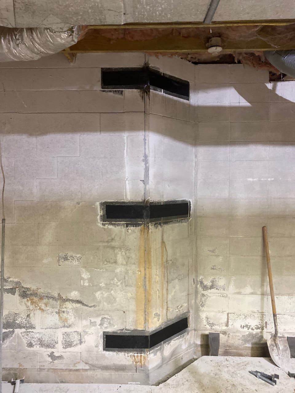HydroHelp911 Crawl Space & Foundation Repair applying carbon fiber reinforcement to a bowing basement wall