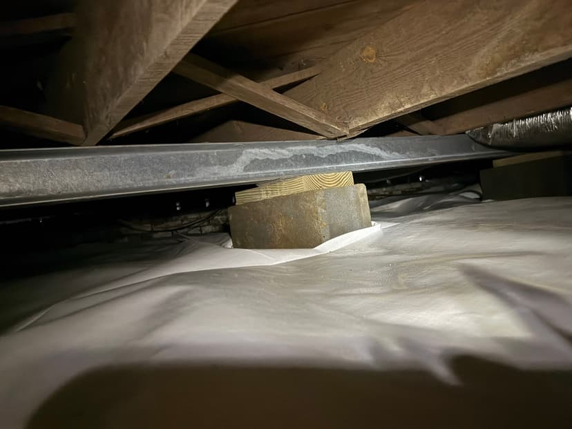 HydroHelp911 Crawl Space & Foundation Repair installing crawl space jacks and a vapor barrier for structural repair.