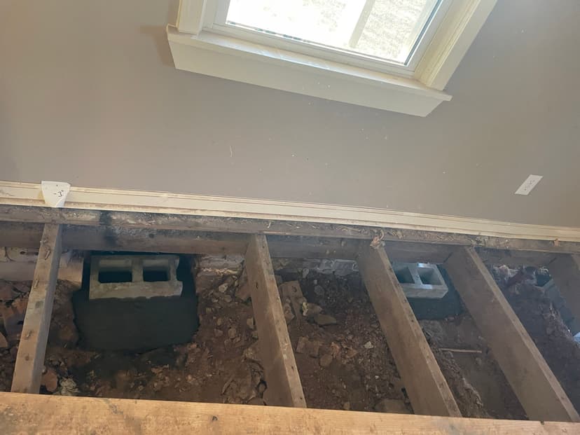 HydroHelp911 Crawl Space & Foundation Repair installing concrete block piers for crawl space structural repair.