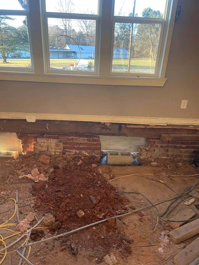 HydroHelp911 Crawl Space & Foundation Repair performing structural repair on a crawl space foundation.