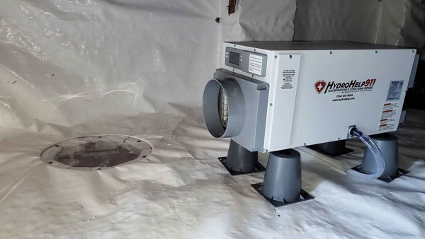 Encapsulated crawl space with a dehumidifier