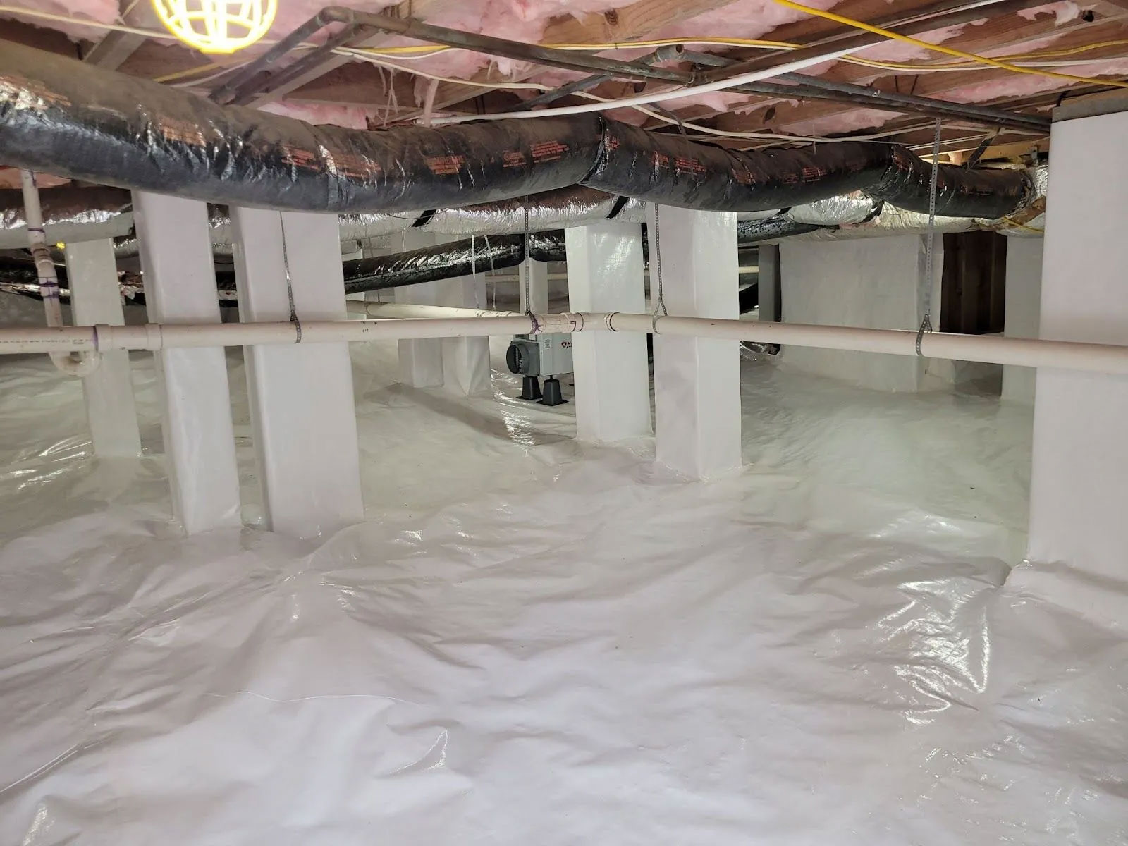 Full encapsulated crawl space with new insulation and a dehumidifier