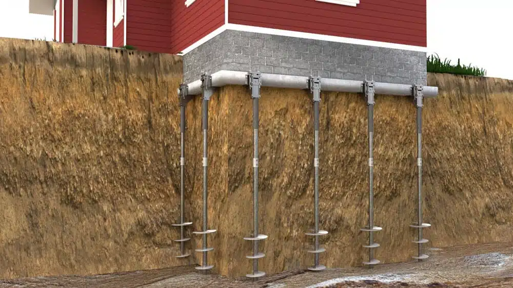 Helical piers or piles are long, screw-like steel posts that contractors drill into the ground to help hold up buildings and other structures.